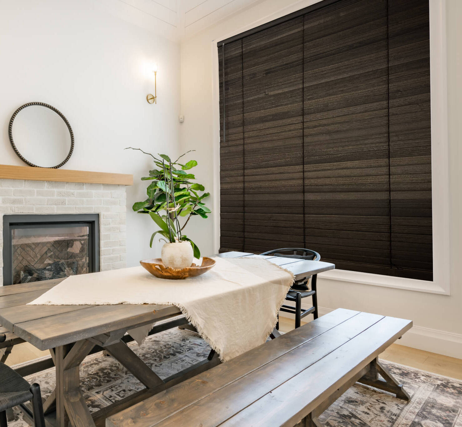 Dining,room,with,dark,maple,table,with,bench,seats,fireplace